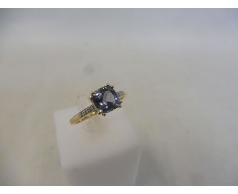 A tanzanite and diamond 9K gold ring, size R to S, with authenticity certificate, approx 2.2g.