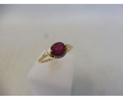 A rubellite and diamond 9K gold ring, size R to S with authenticity certificate, approx 2.2g.