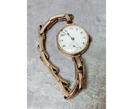 A 9ct rose gold lady?s wristwatch and expanding 9ct rose gold bracelet, 15 jewel movement, white enamel dial, black Arabic nu