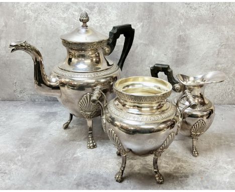 A French Empire taste three piece tea service, the teapot spout terminating in phoenix mask with shaped horn handle, all with