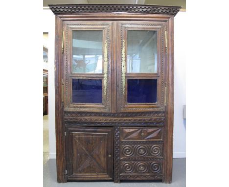 19TH CENTURY FRENCH OAK CABINET, converted from a Breton Armoire and now having dentil cornice over two glazed doors with fit