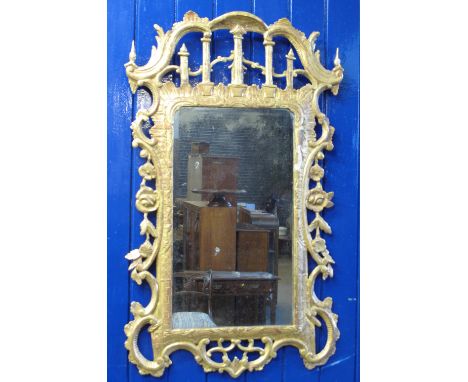 CHINESE CHIPPENDALE DESIGN CARVED, GILDED, WOODEN PIER GLASS with 'C' scroll and foliate designs around the rectangular plate