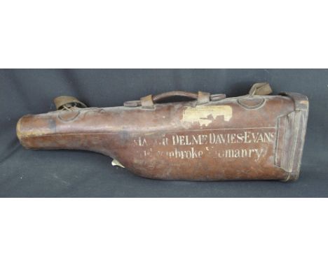 19TH CENTURY LEATHER DOUBLE LEG O' MUTTON SPORTING GUN CASE with shoulder strap and carrying handle, various remnants of trav