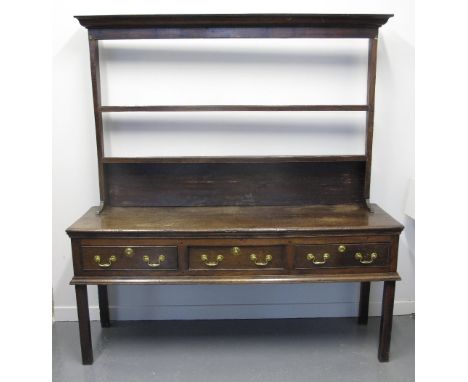 18TH CENTURY OAK DRESSER BASE having moulded edge top over three cock beaded frieze drawers, standing on square legs. Togethe