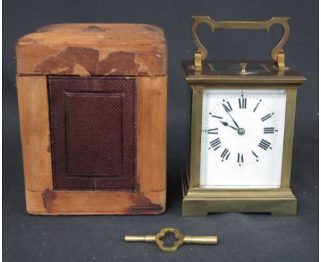 FRENCH BRASS CARRIAGE CLOCK with full depth enamel face, having Roman numerals, the brass movement with exposed escapement, m