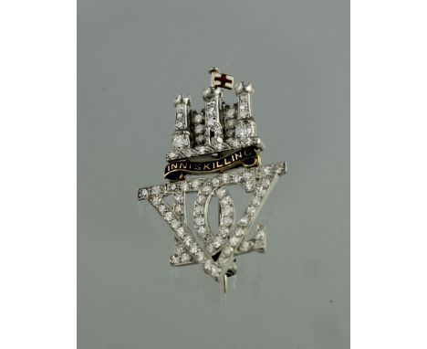 AN EDWARDIAN DIAMOND AND ENAMEL 'INNISKILLING' REGIMENTAL SWEETHEART BROOCH modelled as a three turreted, diamond set castle 