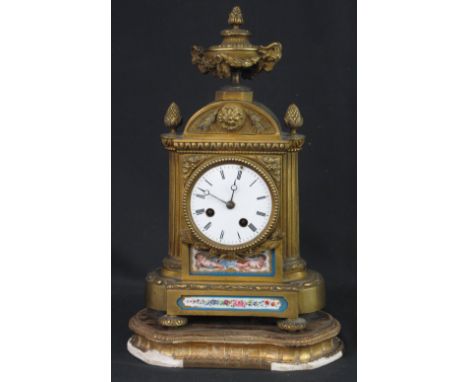 19TH CENTURY FRENCH ARCHITECTURAL ORMOLU MANTEL CLOCK, the case surmounted by ram's head and swag mounted urn over an arch pe