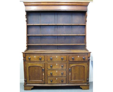 EARLY 19TH CENTURY NORTH WALES OAK DRESSER, having moulded cornice over boarded, three shelf rack back, the base with mahogan