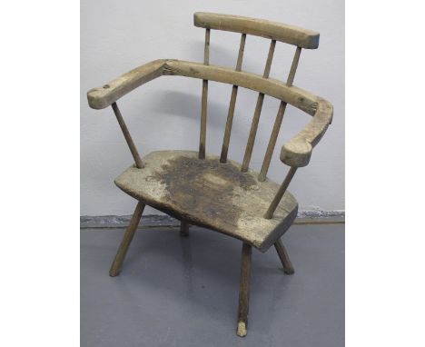 A 19TH CENTURY PRIMITIVE WELSH ASH AND ELM STICK BACKED ELBOW CHAIR.  CONDITION REPORT: Very rickety, very dry, seat is stain