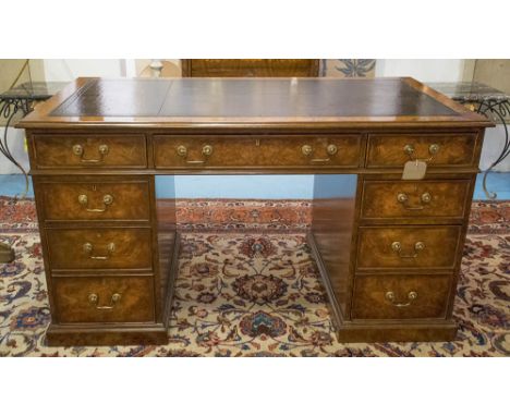 PEDESTAL DESK, George III design burr walnut with seven drawers, twin pedestals and gilt tooled leather top, 140cm W x 77cm D