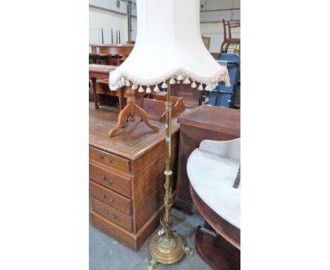 A brass telescopic lamp standard