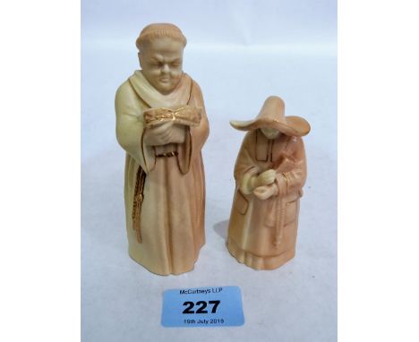 A Royal Worcester blush ground and gilded candle snuffer, viz monk with book and a similarly decorated snuffer, nun with book