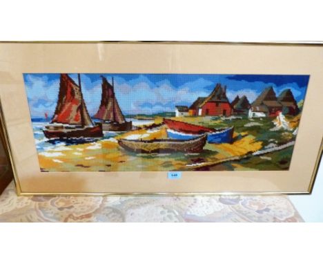 A brass framed tapestry picture, beach scene with boats
