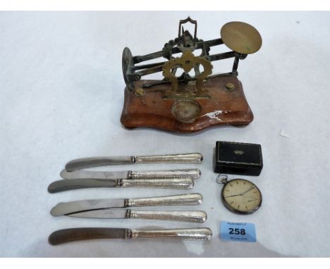 Six silver hafted cake knives, letter scales, a silver cased keyless watch (A.F) and a papier-mache snuffbox