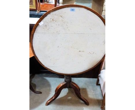 A 19th century oak snap-top table on tripod support. 31'' diameter. Top painted