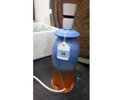 A Ruskin lamp base, glazed in shades of blue, green and terracotta. Impressed mark 'Ruskin'. 9¾'' high. Cracked