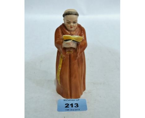 A Royal Worcester candle snuffer, monk with bible. 1919
