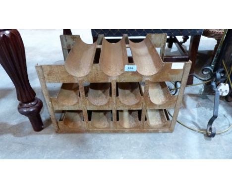 A vintage metal 11 bottle wine rack
