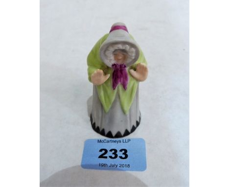 A Royal Worcester candle snuffer, Welsh Lady in polychrome glaze