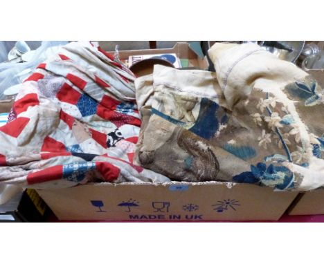 A tapestry wall hanging and a patchwork quilt