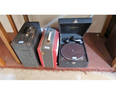A 1930's picnic gramophone, a 1960's tape recorder and a typewriter