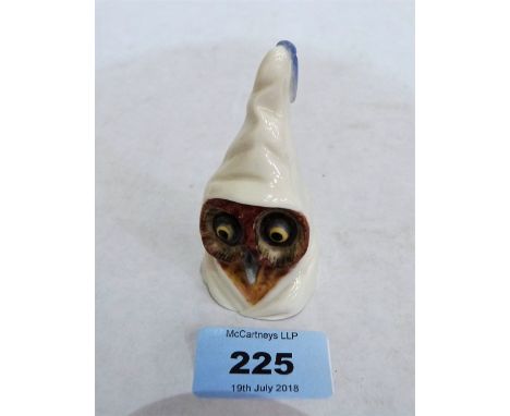 A Royal Worcester candle snuffer, owl in monk's cowl. 1891