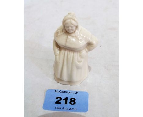 A Royal Worcester candle snuffer, French Cook in white glaze. 1895