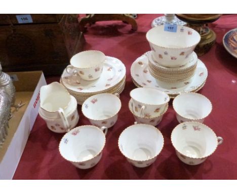 An Aynsley part tea service, painted with scattered flowers, comprising 30 pieces. One cup with hair crack