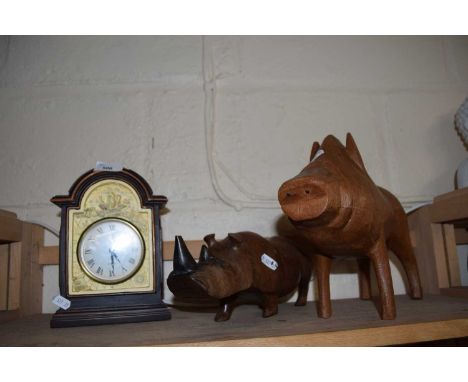Mixed Lot: A wooden model rhino, a wooden warthog and a modern mantel clock (3)