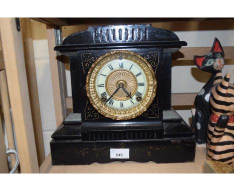 Late Victorian iron cased mantel clock