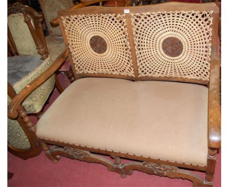 An early 20th century beech and cane back two seater Bergere sofa; together with a pair of late Victorian walnut salon chairs
