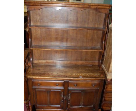 An Ercol dark elm dresser