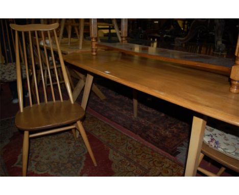 An Ercol light elm dining table, together with a matching set of four Ercol light elm stickback dining chairs (5) Condition R