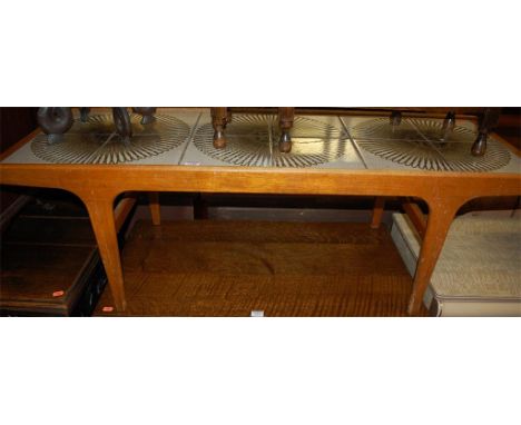 A 1970s teak and tile-top inset long coffee table