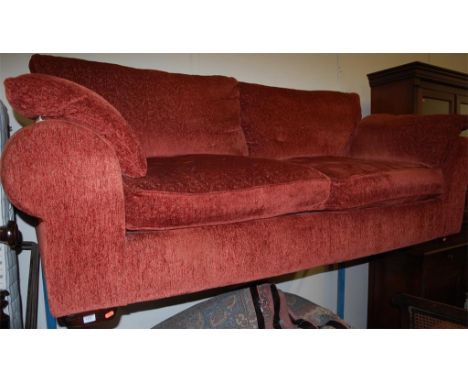A modern upholstered three seater sofa