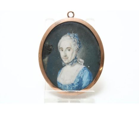 A portrait miniature in rose gold frame, 19th. Century, goldmark  in eye, 6,2 x 5,2 cm., miniature damaged middle left.Portre