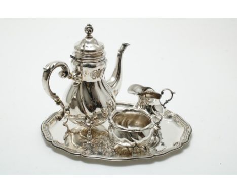 A silver tea set with sugar and milk jar, teapot, on a tray,  gross weight 822 gr., GermanyZilveren thee servies waarbij suik