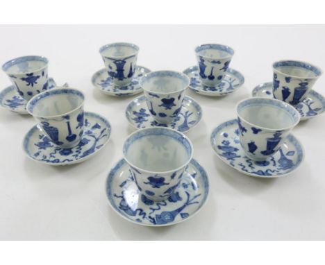 A set of 8 porcelein cup and saucers with decor of vases,  shopkeepersmark in double ring, China 19th century. (2 cups  with 