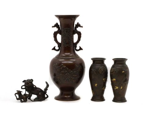 A group of Japanese plum bronze vases  comprising a vase of baluster form, twin handled modelled as seahorses, decorated with