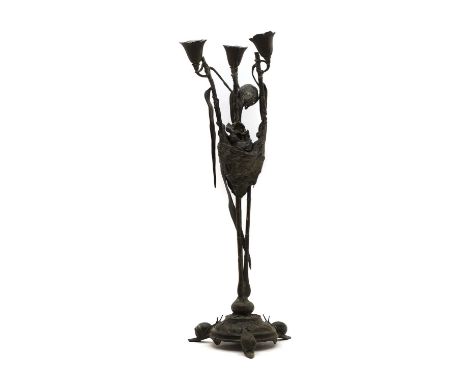 After Auguste Nicolas Cain a bronze three-light candelabra, with leaf-cast sockets issuing from a bird's nest holding chicks 