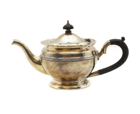 A silver teapot by William Devenport, Birmingham 1931, 25cm wide 15cm high 13.3ozt 