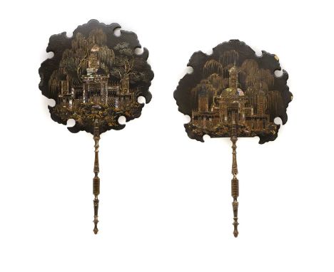 A pair of Victorian papier mache face screens depicting architectural scenes, inlaid with mother of pearl, to turned wood han
