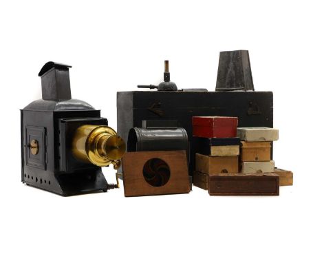 A magic lantern and slides, early 20th century, painted tin and brass, with eight boxed sets of Nursery Tales for the Magic L