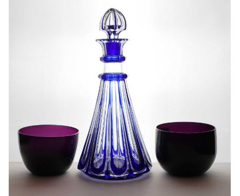 A cased glass decanter, 19th century, cased in cobalt blue over clear, with linear cut decoration and a hollow blown stopper,