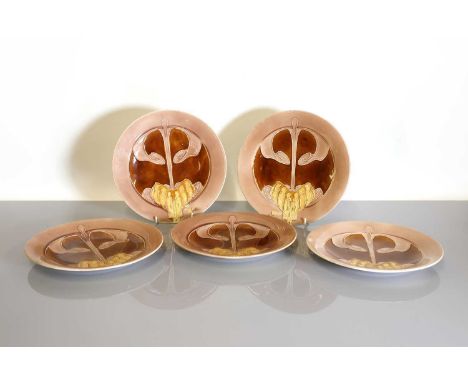 A set of ten Minton plates, c.1904, each with tubelined decoration of a stylised Art Nouveau flower in mauve, brown and yello