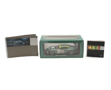 An Aston Martin DBR9 1:18 scale model limited edition 3000, in original box, with brochures