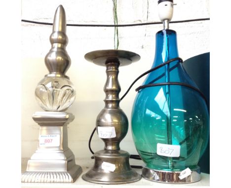 BLUE GLASS LAMP, METAL CANDLESTICK AND AN ORNAMENT       F5