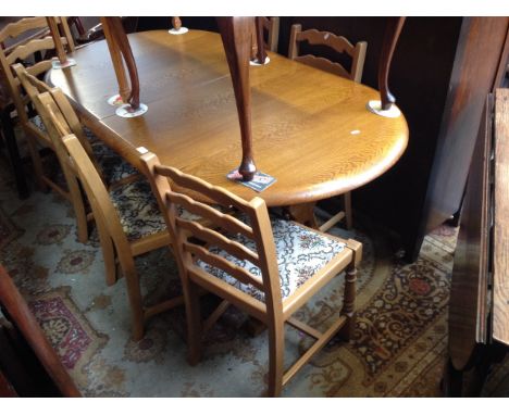 EXTENDING OAK DINING TABLE AND LADDER BACK CHAIRS