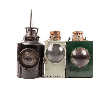 3 LMS/SR Railway lamps. A LMS black painted lamp marked ‘The Adlake Non Sweating Lamp’, bracket to side. A SR green painted s
