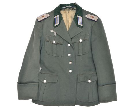 A Third Reich style Army Medical officer’s 4 pocket tunic, the added insignia comprise epaulettes, collar patches and breast 